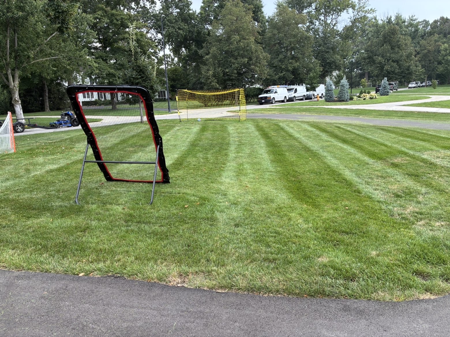 Backyard practice field with crisp mowing stripes